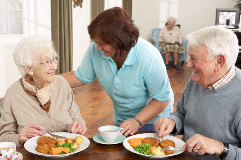 Happy seniors eating